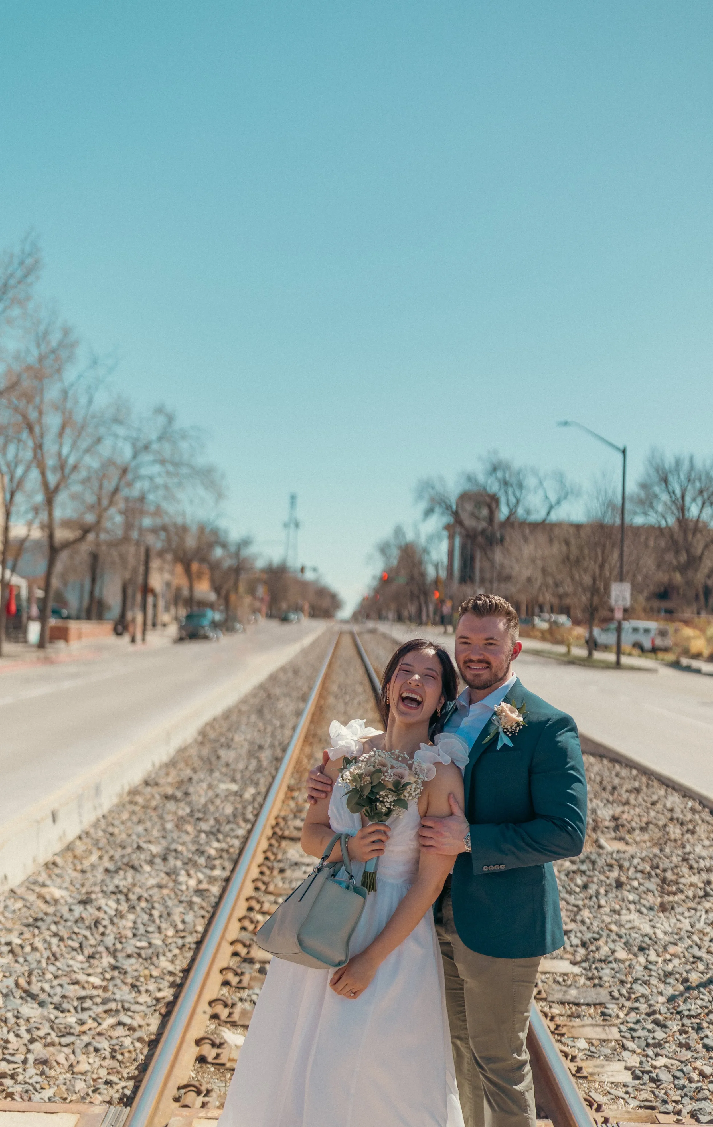 Newlyweds laughing together after their courthouse ceremony