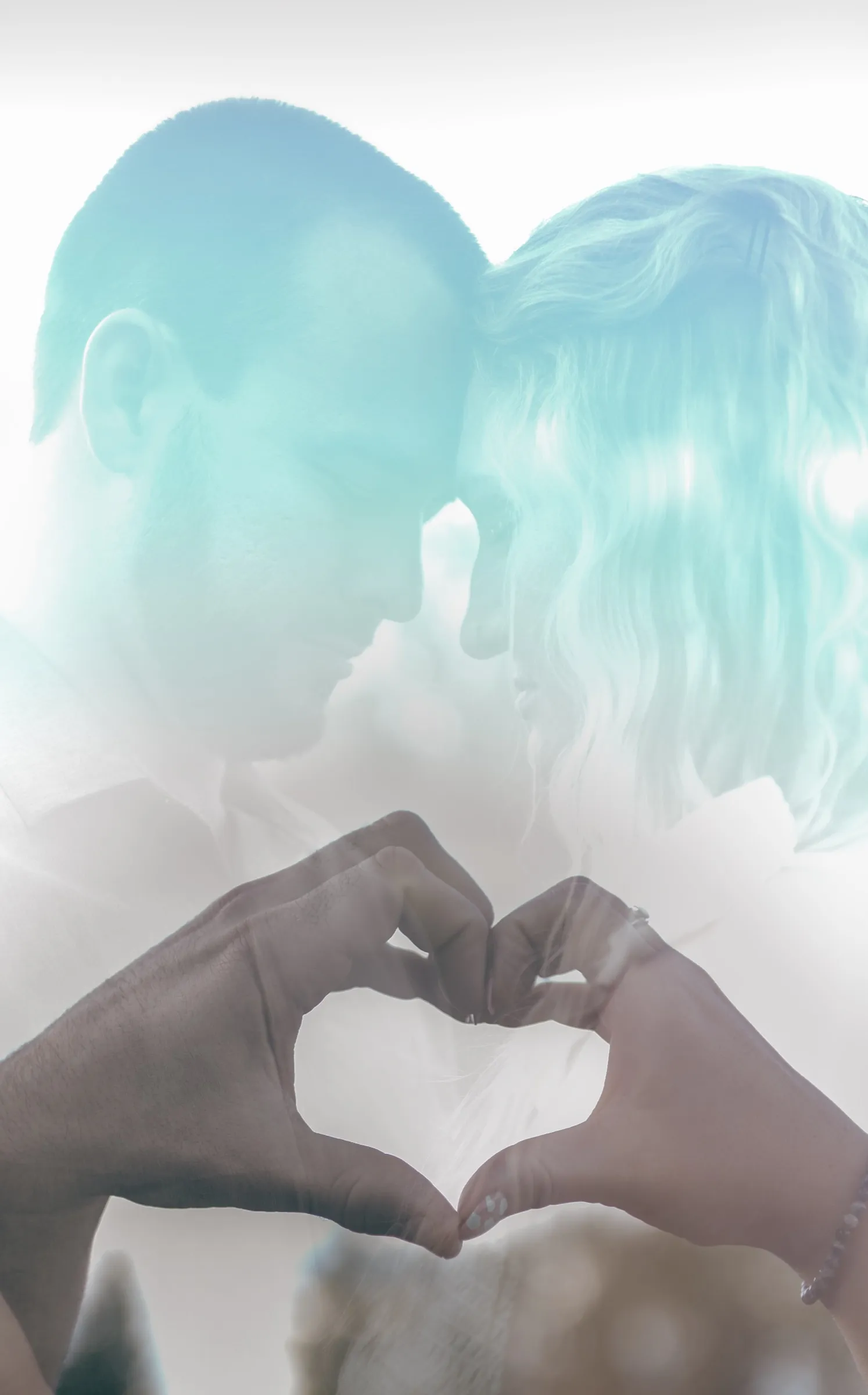 Double exposure of a couple facing each other, their hands forming a heart